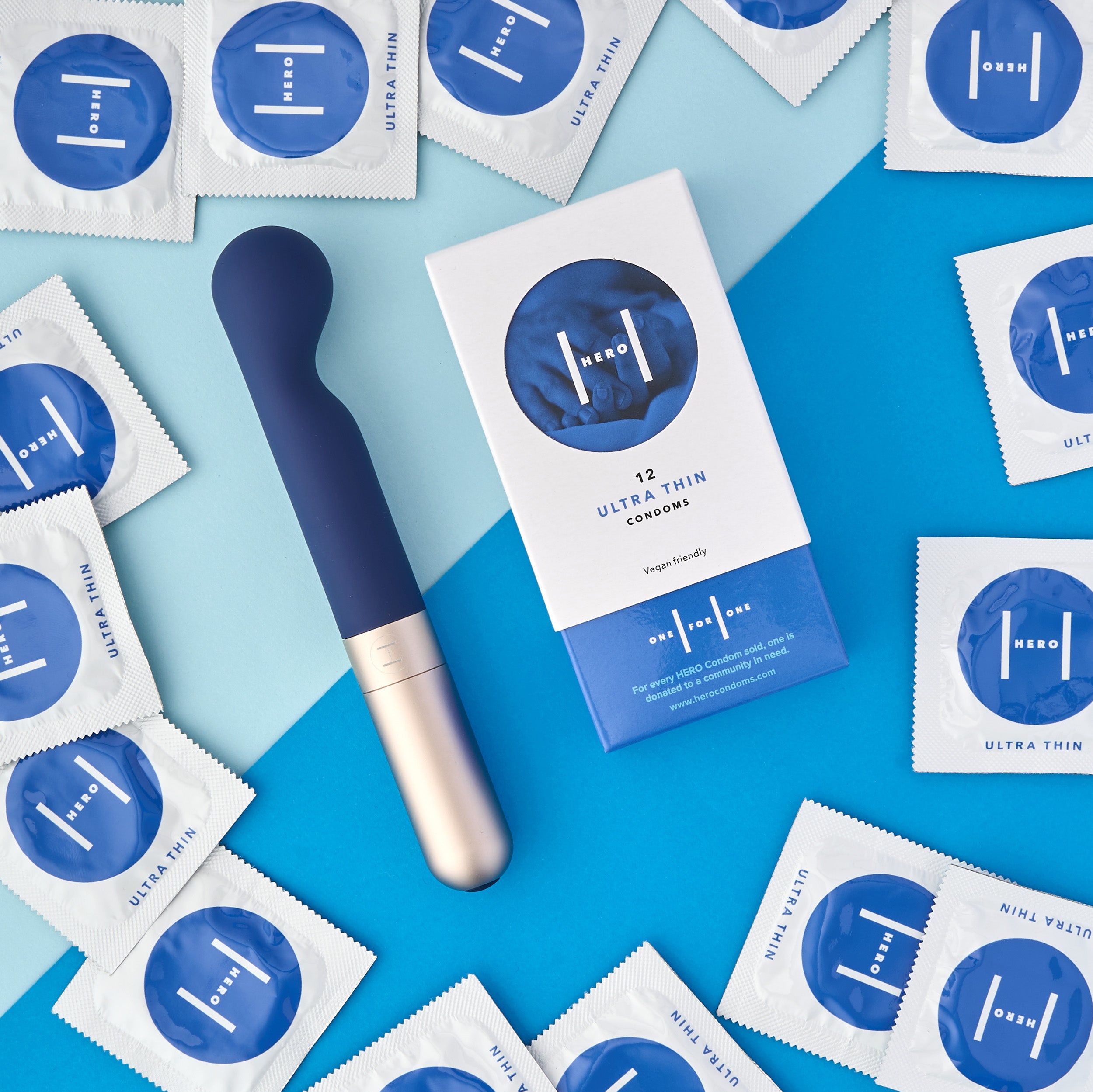 Hero Condoms packaging and condoms displayed around KAMA - quiet G-spot vibrator