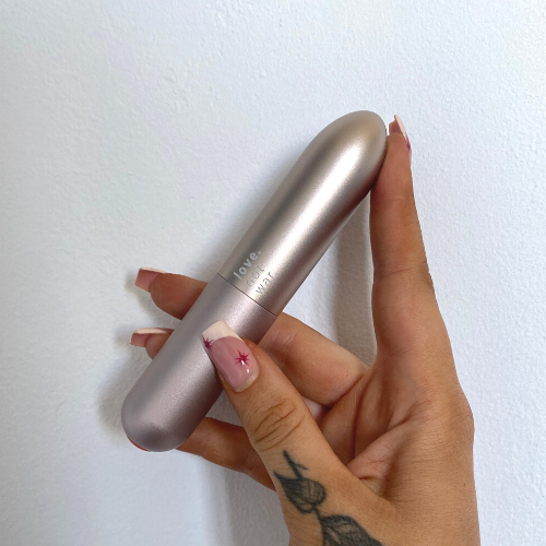 Maya bullet vibrator by Love Not War held in a hand