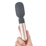 Hand holding Koi wand vibrator 